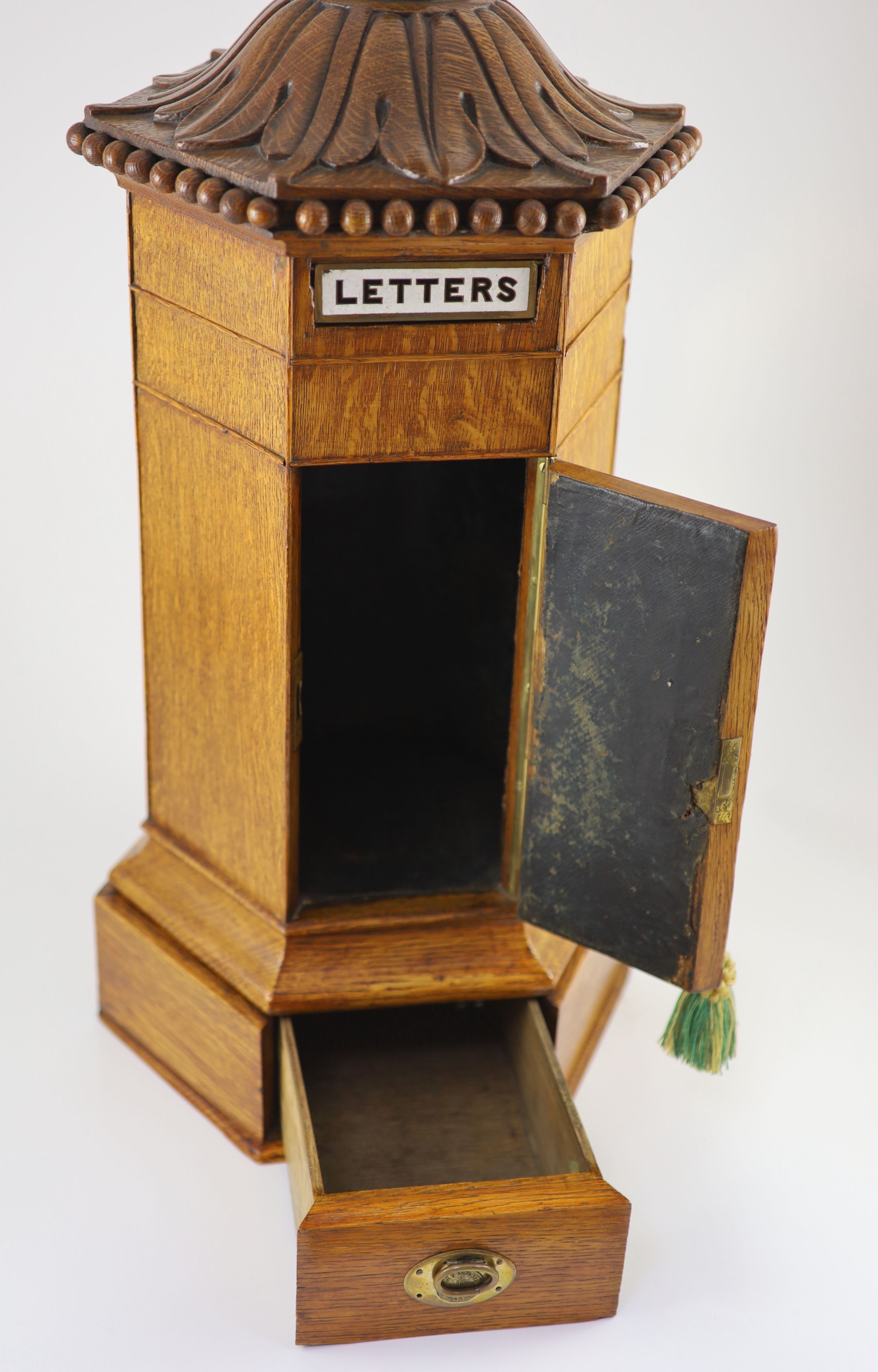 A Victorian oak hexagonal letter box, retailed by Walter Thornhill of 144 New Bond Street H 67cm. W 31cm. D. 26cm.